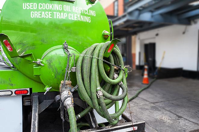 a grease trap being pumped by a sanitation technician in Poughkeepsie, NY